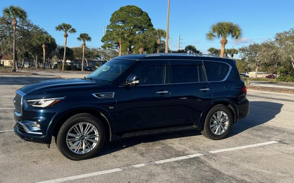 Dark navy Nissan Armada SUV - side profile